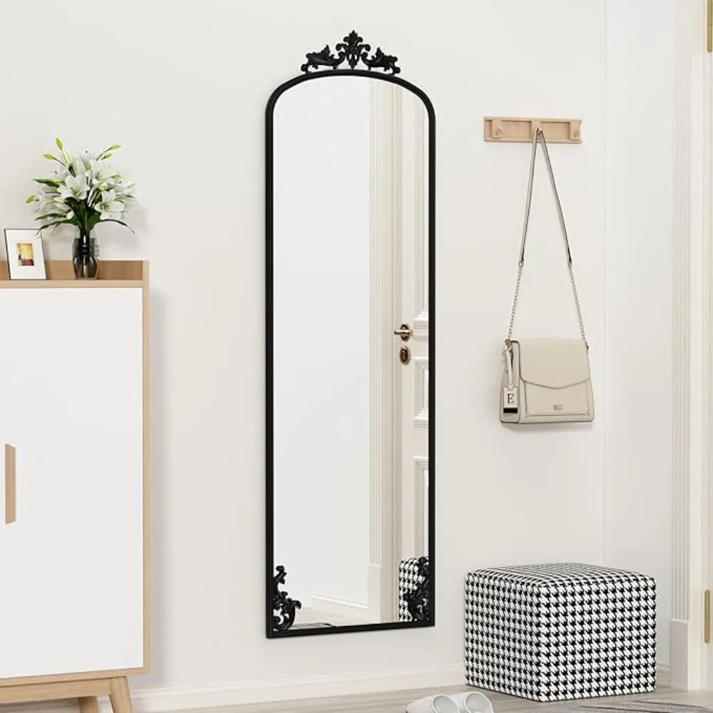 Arched full-length mirror with carved metal frame