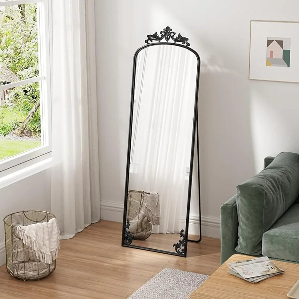 Arched full-length mirror with carved metal frame