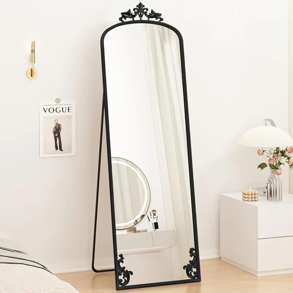 Arched full-length mirror with carved metal frame
